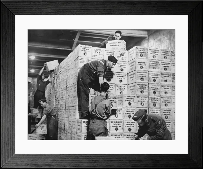 Framed Print : Lend Lease war materials for England. Cases of TNT gunpowder from the USA are stacked in a tunnel 100 feet underground dug out of solid rock in western England. 1941-44