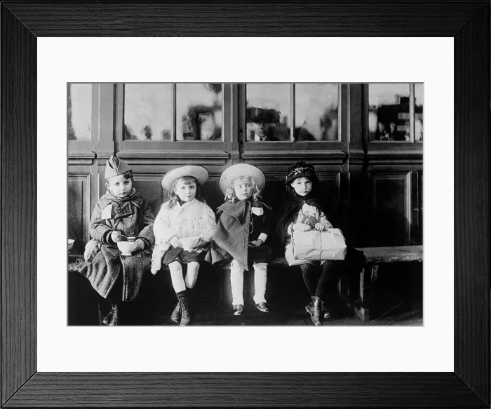 Framed Print : French refugee children during World War I. While waiting for train, children were fed with bread and milk from American Red Cross soldiers canteen. 1917-1918