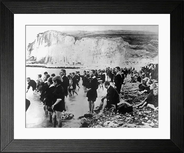 Framed Print : Belgian school children swimming at a beach near Dieppe, Belgium, during an American Red Cross outing. World War I. Ca. 1917-18