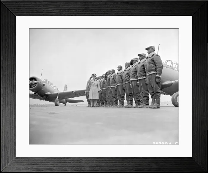 Framed Print : Major James Ellison reviews first class of Tuskegee Airmen, 1941. On left is a Vultee BT-13 trainer aircraft at U.S. Army Air Corps flying school, Tuskegee, Alabama. World War 2