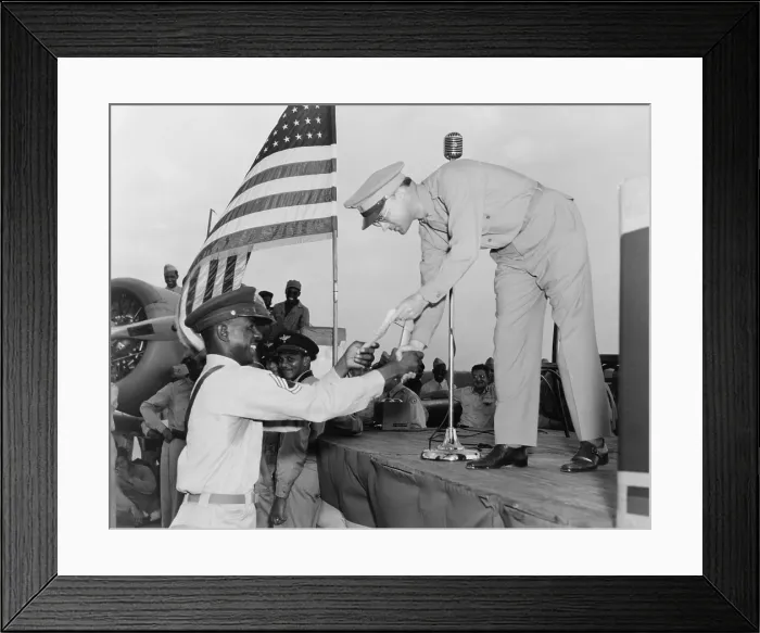 Framed Print : African American Airman receiving a military award at Tuskegee Army Air Field, Alabama. 992 World War 2 pilots were trained in Tuskegee. (BSLOC_2013_11_188) Framed Print : African American Airman receiving a military award at Tuskegee Army Air Field, Alabama. 992 World War 2 pilots were trained in Tuskegee. (BSLOC_2013_11_188)