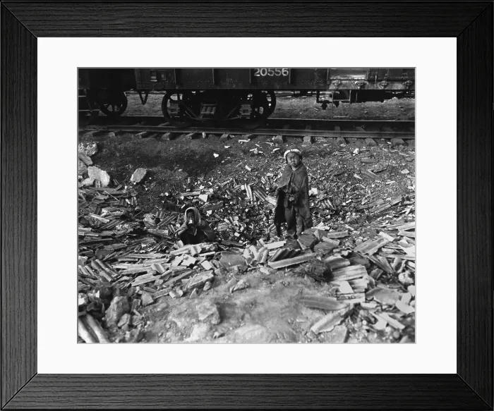 Framed Print : Homeless, possibly orphaned, brother and sister search empty cans for food. Seoul, Korea, railroad yards. November 17, 1950. Korean War, 1950-53. (BSLOC_2014_11_240)