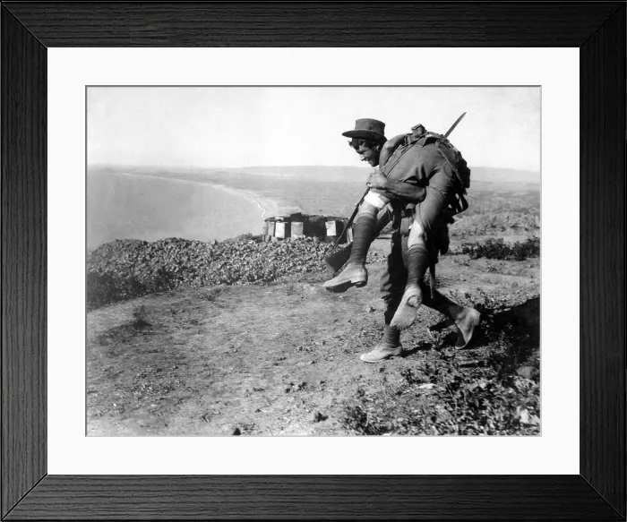 Framed Print : An Australian soldier carrying a wounded comrade during the World War I, Dardanelles Campaign. 1915