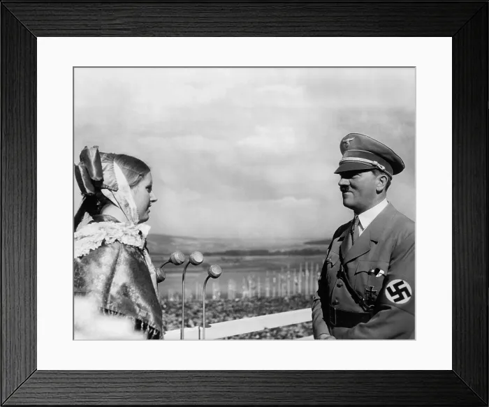 Framed Print : Adolf Hitler with a young woman in folk costume at the 1935 Erntedankfest. The Erntedankfest was an important component of Nazi, blood-and-soil ideology Framed Print : Adolf Hitler with a young woman in folk costume at the 1935 Erntedankfest. The Erntedankfest was an important component of Nazi, blood-and-soil ideology
