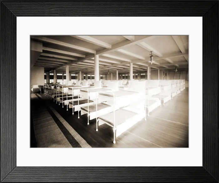 Framed Print : New York City's Municipal Lodging House men's dormitory with rows of bunk beds. The shelter provided 800 iron bunks for men on three floors. 1910