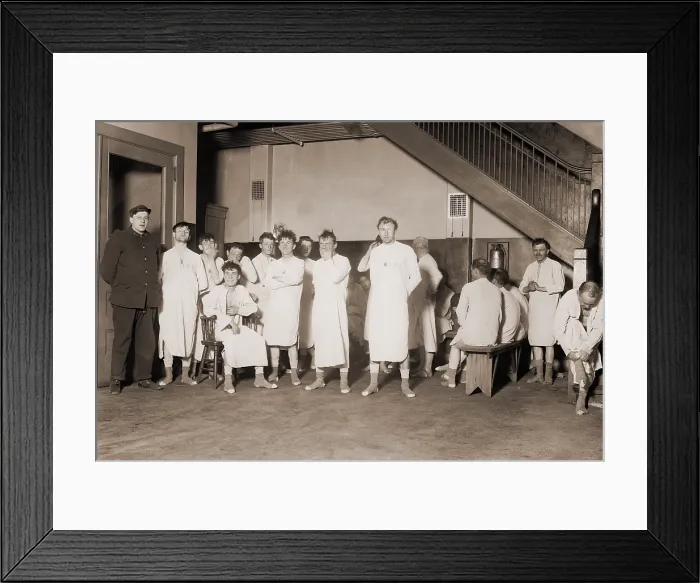 Framed Print : Homeless men in New York City's Municipal Lodging House dressed for bed. To prevent pest infestations they were required to wear nightshirts provided to them by the shelter
