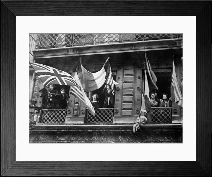 Framed Print : Luxemburg women wave allied flags from their windows to greet the American Army of Occupation at the end of World War I. Nov.-Dec. 1918 Framed Print : Luxemburg women wave allied flags from their windows to greet the American Army of Occupation at the end of World War I. Nov.-Dec. 1918
