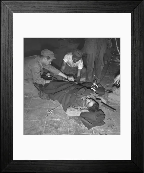 Framed Print : Navy corpsman gives a wounded U.S. Marine blood plasma at Yellow Beach Inchon, Korea. Sept. 19, 1950