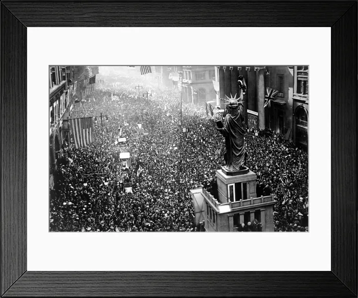 Framed Print : Philadelphia celebrating the armistice ending World War I. Thousands massed on all sides of the replica of the Statue of Liberty on Broad Street on Nov. 11, 1918