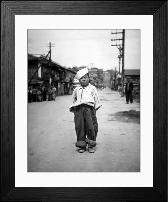 Framed Print : A Korean orphan boy adopted by a motor pool battalion at Inchon, Korea. Called Number One by the soldiers who nursed him back to health. Korean War, 1950-53