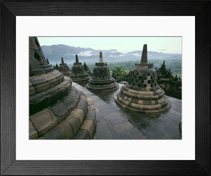 Framed Print : Borobudur Temple. 9th c. INDONESIA. CENTRAL JAVA. Borobudur. Bell-shaped stupas on the roof of the temple. Eastern Art. Architecture