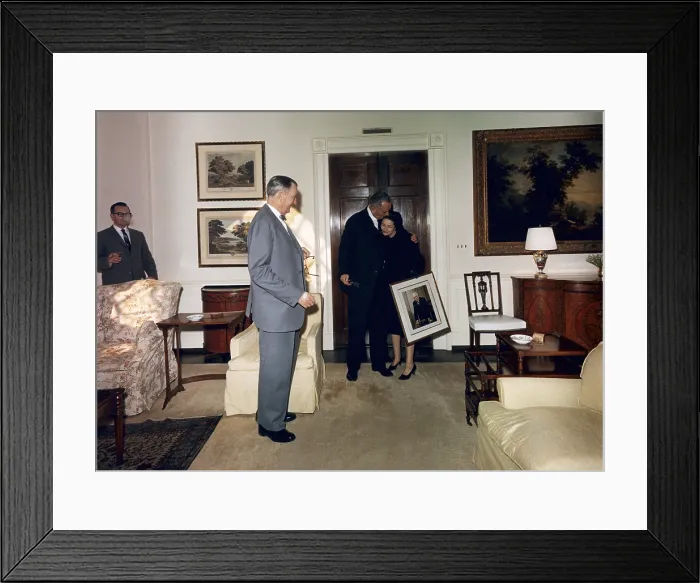 Framed Print : Lyndon and Lady Bird Johnson moving into the White House residence, two weeks after the Kennedy assassination. Lady Bird is carrying a portrait of LBJ's mentor, Sam Rayburn Framed Print : Lyndon and Lady Bird Johnson moving into the White House residence, two weeks after the Kennedy assassination. Lady Bird is carrying a portrait of LBJ's mentor, Sam Rayburn