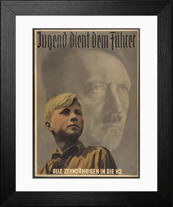 Framed Print : Youth serves the leader - all ten year-olds into the Hitler Youth'. Poster shows German boy wearing Hitler Youth uniform, with portrait of Adolf Hitler behind him. 1941