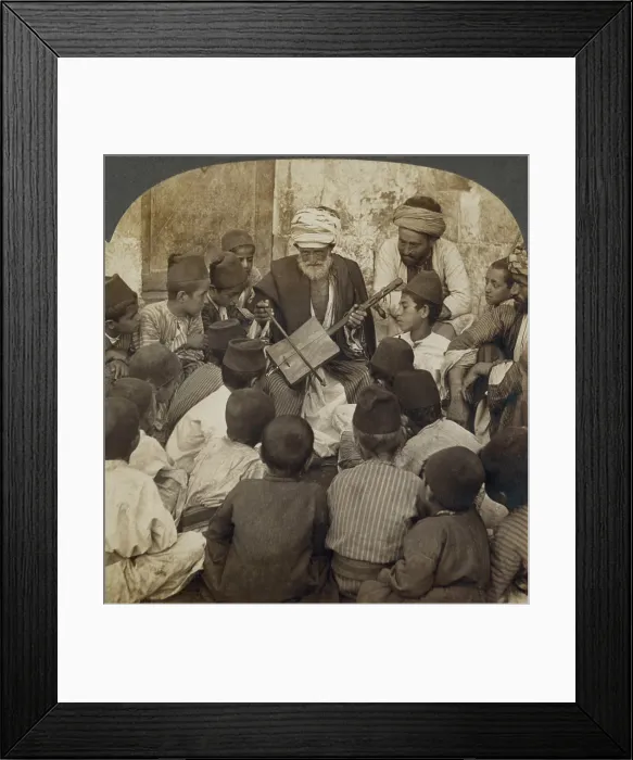 Framed Print : Syrian schoolboys gathered around a man with a Rababeh, a single string instrument with a square sound box played by a string bow. Ca. 1905 Framed Print : Syrian schoolboys gathered around a man with a Rababeh, a single string instrument with a square sound box played by a string bow. Ca. 1905