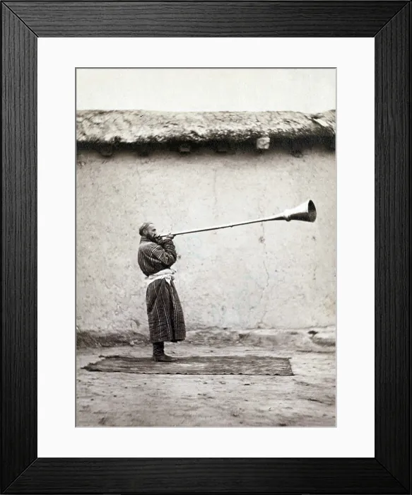 Framed Print : Central Asian man playing a long necked Uzbek instrument called a karnay. 1868