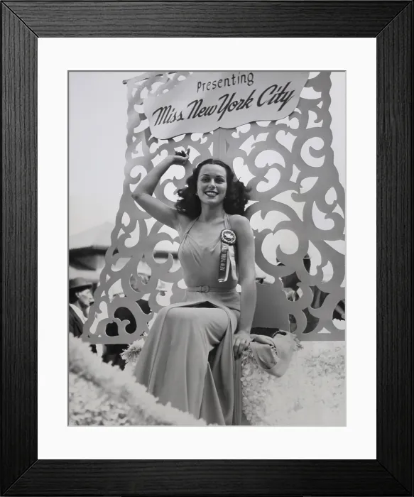 Framed Print : Bess Myerson, seated on the Miss New York City float during the parade in Atlantic City, N.J. Sept. 5, 1945