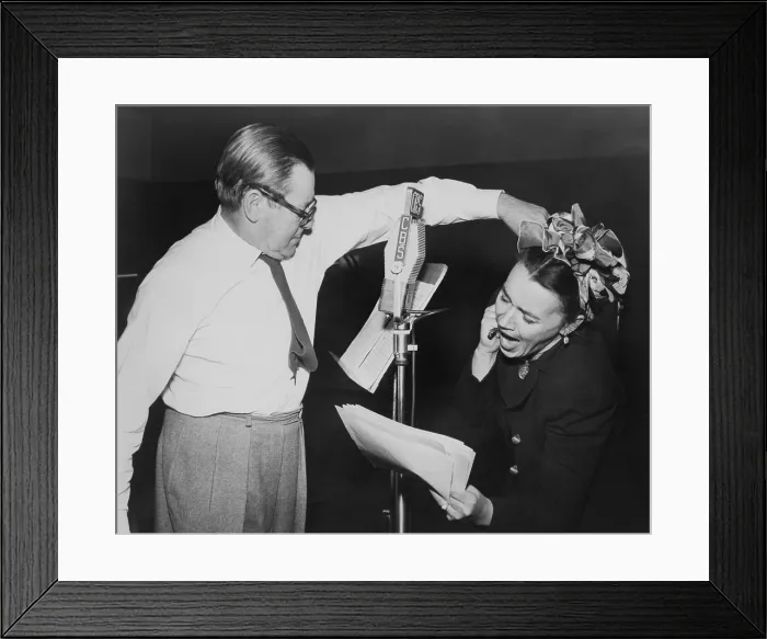Framed Print : Herbert Marshall striking a blow, murdering his wife, in a radio play, Back for the Holidays