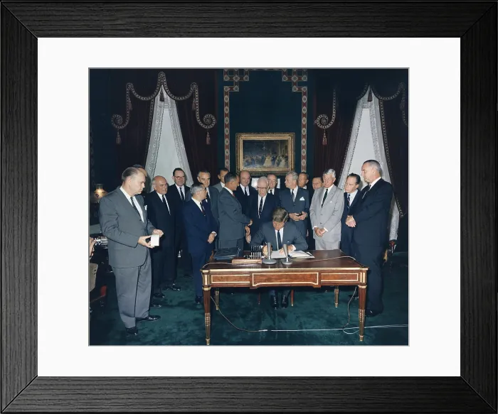 Framed Print : President Kennedy signing the Nuclear Test Ban Treaty which banned nuclear tests in the atmosphere, underwater and in space