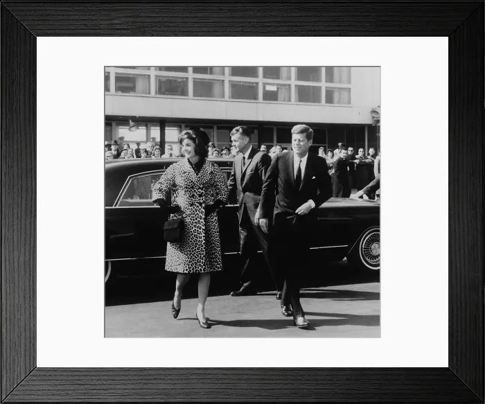 Framed Print : Escorted by President Kennedy, Jacqueline Kennedy departs for trip to India and Pakistan wearing an Oleg Cassini leopard skin coat Framed Print : Escorted by President Kennedy, Jacqueline Kennedy departs for trip to India and Pakistan wearing an Oleg Cassini leopard skin coat