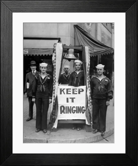 Framed Print : Fourth Liberty Loan Campaign during World War I. Sailors with a model of the Liberty Bell and a sign Keep It Ringing'. Seattle, Washington. 1918