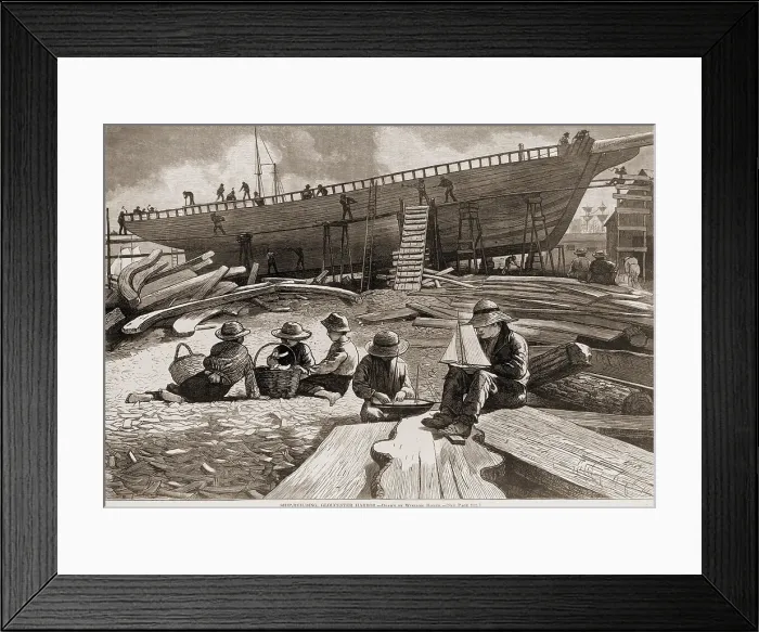 Framed Print : Children building model ships in the foreground at a shipyard, while men build a ship in the background. Wood engraving by Winslow Homer. 1873