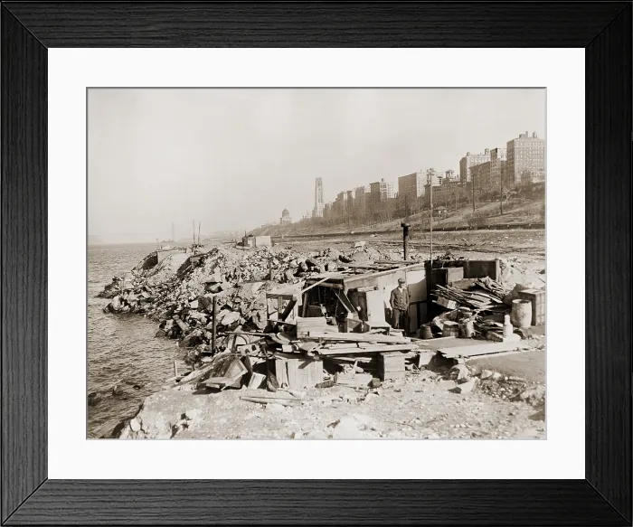 Framed Print : An unemployed a man standing near his hut in a New York City shanty town during the Great Depression Framed Print : An unemployed a man standing near his hut in a New York City shanty town during the Great Depression