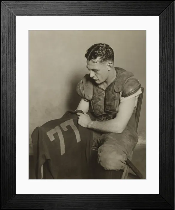Framed Print : Harold Red Grange holding his football jersey number. His number 77 was retired at the University of Illinois in 1925. - (BSLOC_2015_1_112)