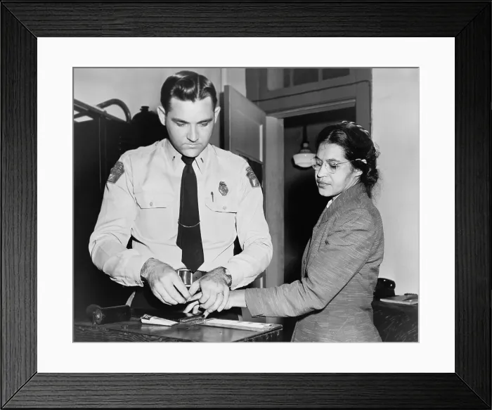 Framed Print : Rosa Parks (1913-2005), whose refusal to move to the back of a bus touched off the bus boycott in Montgomery, Alabama. Fingerprinting Parks is Deputy Sheriff D.H. Lackey