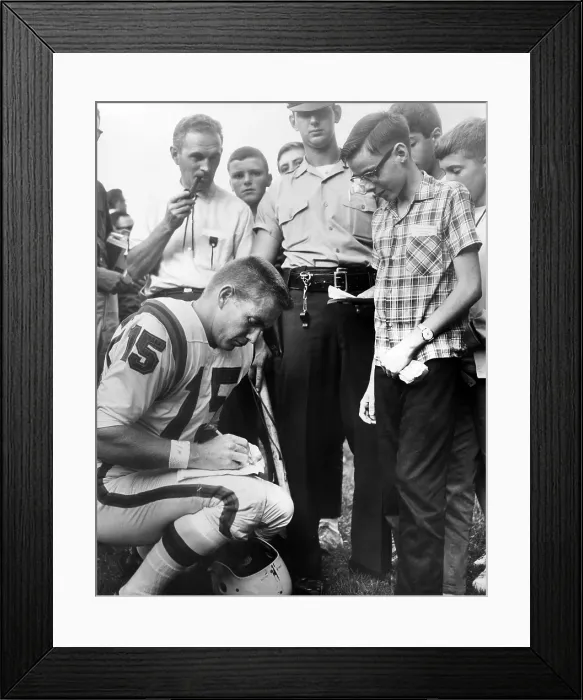 Framed Print : Buffalo Bills player Jack Kemp signs his autograph for a boy on August 4, 1964. Kemp played professional football from 1957 to 1969