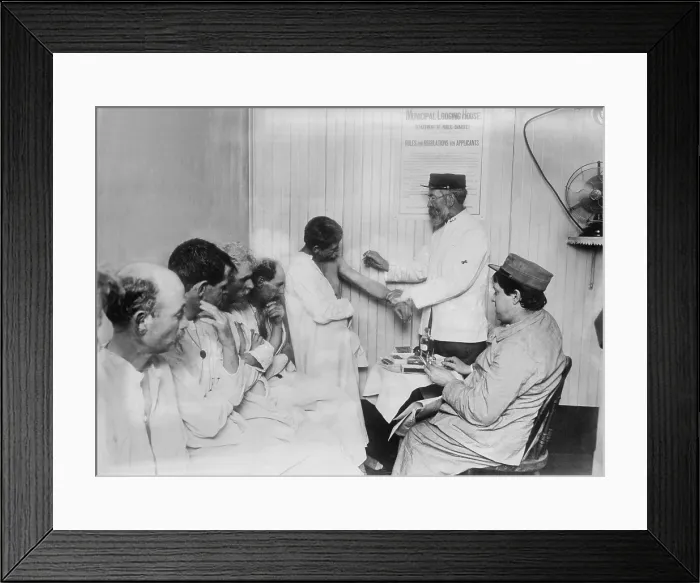 Framed Print : New York City's Municipal Lodging House vaccinated homeless tenants. On the wall is a poster stating the rules of the shelter. 1910 Framed Print : New York City's Municipal Lodging House vaccinated homeless tenants. On the wall is a poster stating the rules of the shelter. 1910