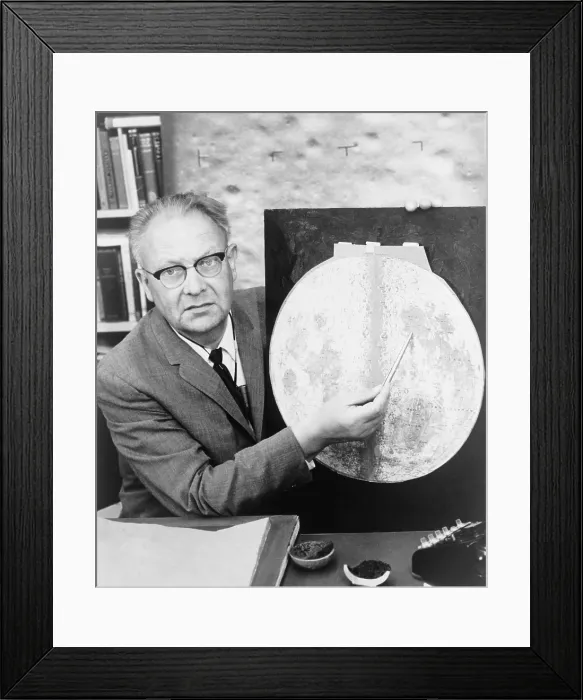 Framed Print : Gerard P. Kuiper (1905-1973), Dutch born American astronomer, holding pointer to a map of the moon