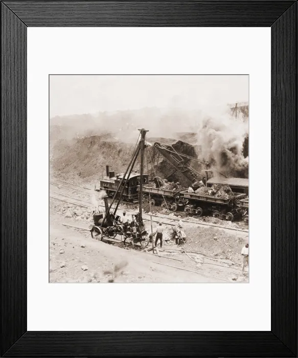 Framed Print : Panama Canal construction. A steam shovel loads excavated rocks into railroads cars at Gatun Dam site, Panama Canal Zone. 1910
