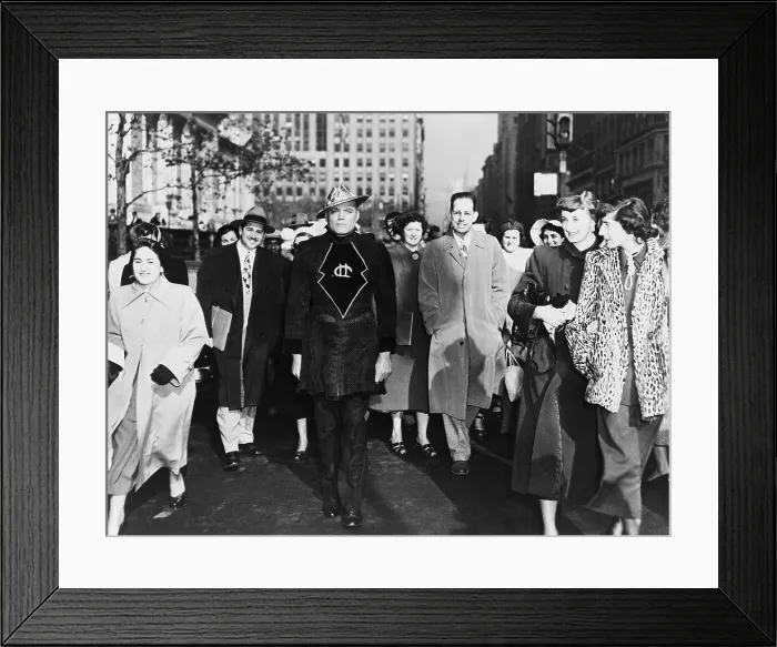 Framed Print : A laughing crowd accompany a man dressed in a Martian costume crossing a street in Mid-town Manhattan on November 6, 1950