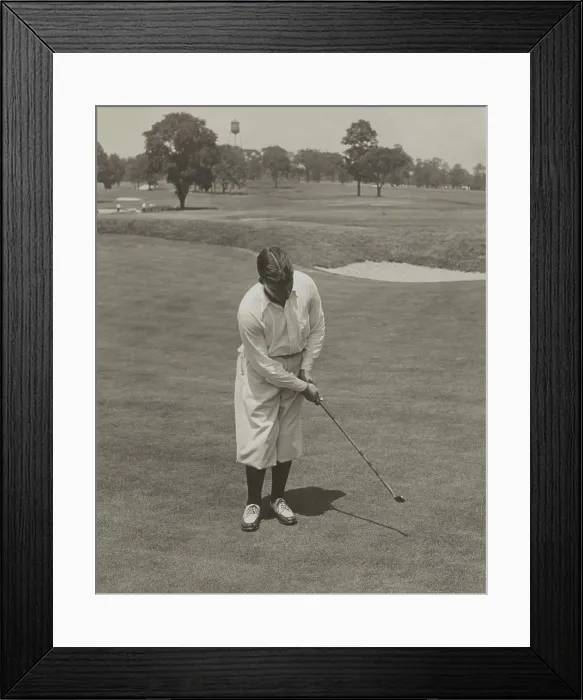 Framed Print : Bobby Jones, winner of 1929 National Open Golf Championship. He is sinking a putt with his famous putter, Calamity Jane'. - (BSLOC_2015_1_121)