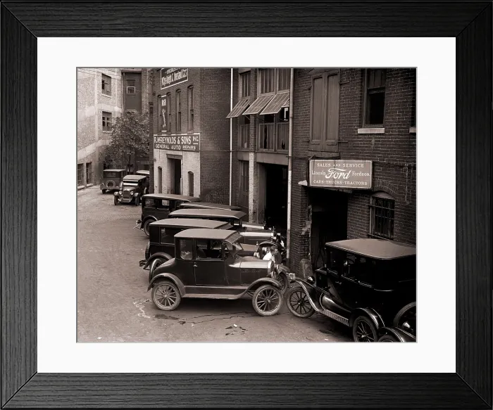 Framed Print : Model Ts, and one more luxurious Lincoln (center front) are parked by a Ford Motor Company dealership in Washington, D.C. in 1926 Framed Print : Model Ts, and one more luxurious Lincoln (center front) are parked by a Ford Motor Company dealership in Washington, D.C. in 1926