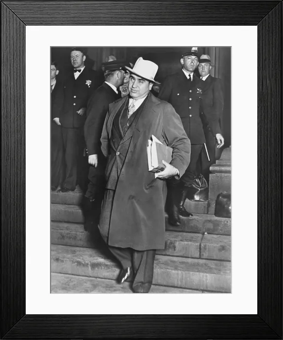 Framed Print : Al Capone, winks at photographers as he leaves Chicago's federal courthouse. October 14, 1931. The notorious Chicago gangster was on trial for tax evasion. - (BSLOC_2015_1_13)