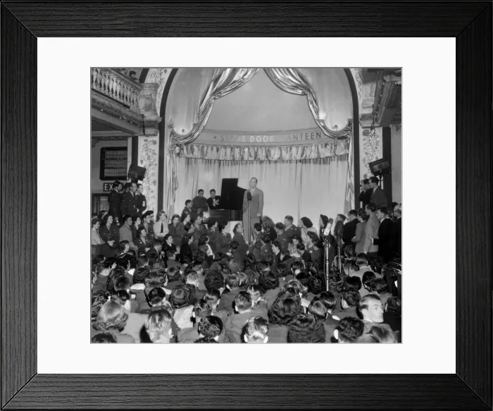 Framed Print : Bing Crosby sings to Allied troops at the London Stage Door Canteen during World War 2. Aug. 31, 1944, in Piccadilly, London, England. (BSLOC_2013-12_136) Framed Print : Bing Crosby sings to Allied troops at the London Stage Door Canteen during World War 2. Aug. 31, 1944, in Piccadilly, London, England. (BSLOC_2013-12_136)