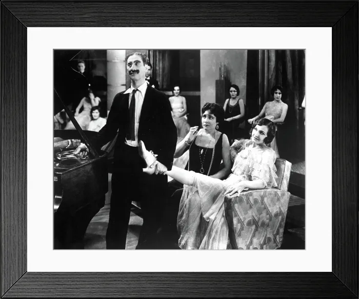 Framed Print : ANIMAL CRACKERS, Groucho Marx, Margaret Dumont, 1930, holding her leg