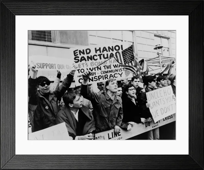 Framed Print : Pro-Vietnam War demonstrators. Counter-demonstrators, holding signs urging the bombing of Hanoi while protesting a peace march to the United Nations. New York City. April 15, 1967