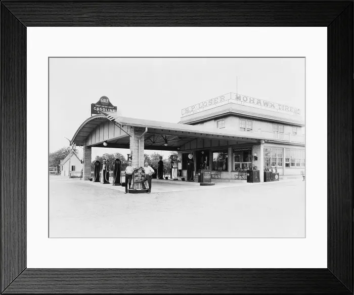 Framed Print : Service station in Avon, Pennsylvania with gasoline pumps and station attendants. Ca. 1940s