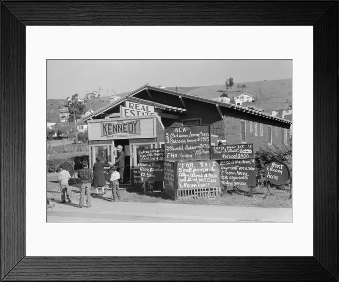 Framed Print : Real estate office in Oakland, California, advertises homes selling for less than $5, 000. Dec. 1940