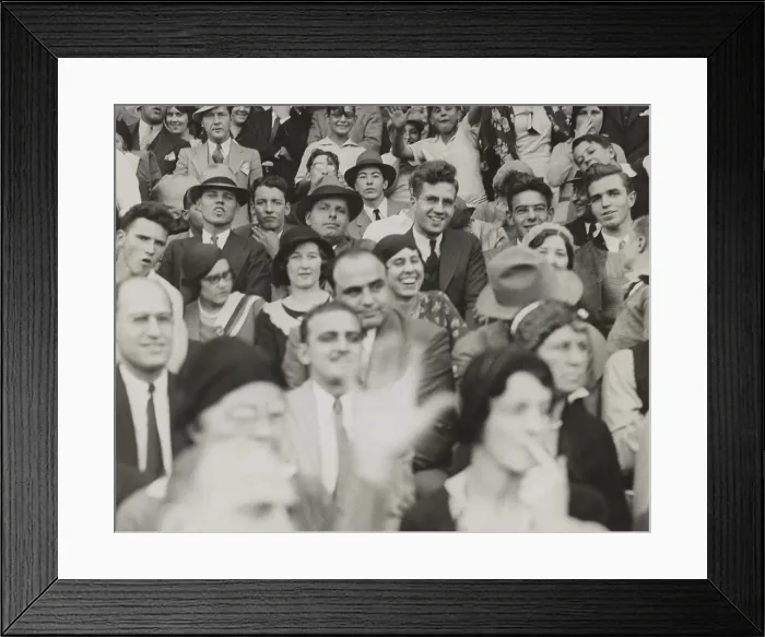 Framed Print : Al Capone (center), seated in front of three women, watching a college football game