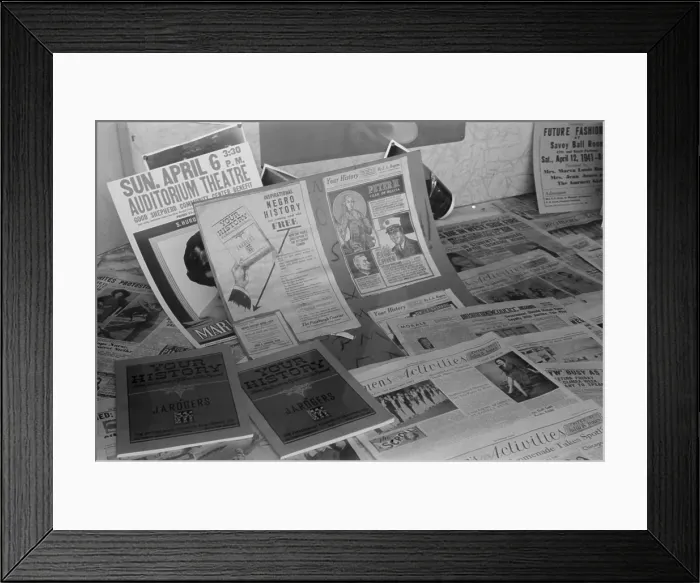 Framed Print : African American literature on display in the Chicago office of the Pittsburgh Courier. The display includes history books and Pittsburgh Courier Newspaper headlines. April 1941