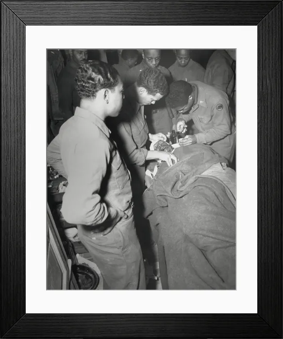 Framed Print : African American Army surgeon stitches face and shoulder wounds in the Pietrasanta Area, Italy. Feb. 10, 1945. Capt. Ezekia Smith, 370th Inf. Regt. 92nd Div