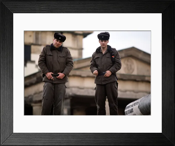Framed Print : East German guards at ease atop the Berlin Wall at the Brandenburg Gate the East-West Berlin border on Dec. 22 1989. (BSLOC_2011_3_47)