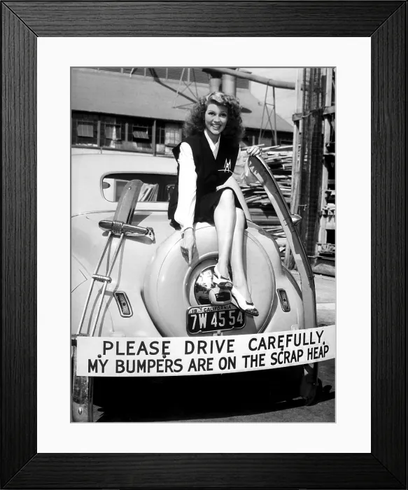 Framed Print : Movie star Rita Hayworth sacrificed her bumpers for World War 2 scrap metal drive. 1942. (BSLOC_2013-12_144)