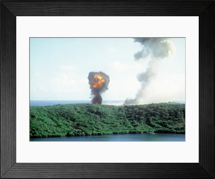 Framed Print : Explosion from a direct U.S. hit on a Grenadian position on the first day of the U.S. lead invasion of the Caribbean island on Oct. 25 1983. (BSLOC_2011_3_6)