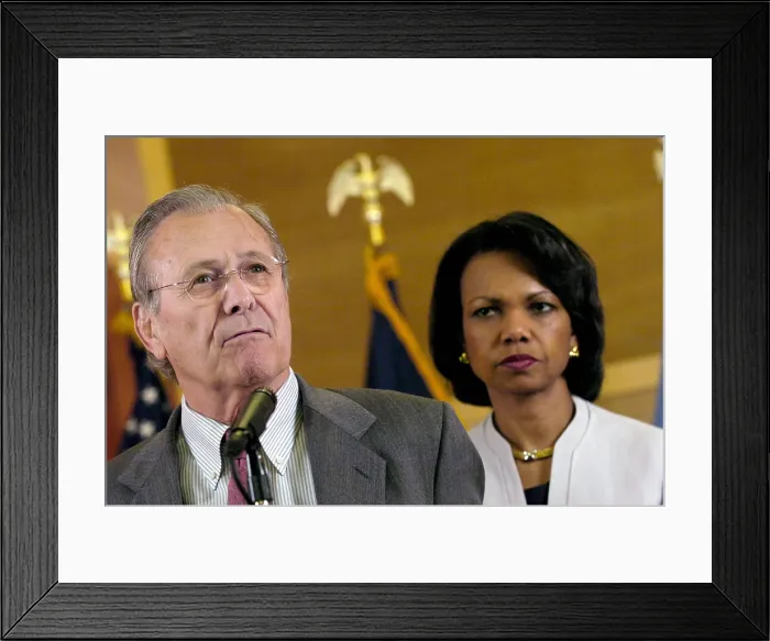 Framed Print : Secretary of Defense Donald H. Rumsfeld speaks to reporters as Secretary of State Condoleezza Rice listens. Baghdad Iraq April 27 2006. (BSLOC_2011_3_60)