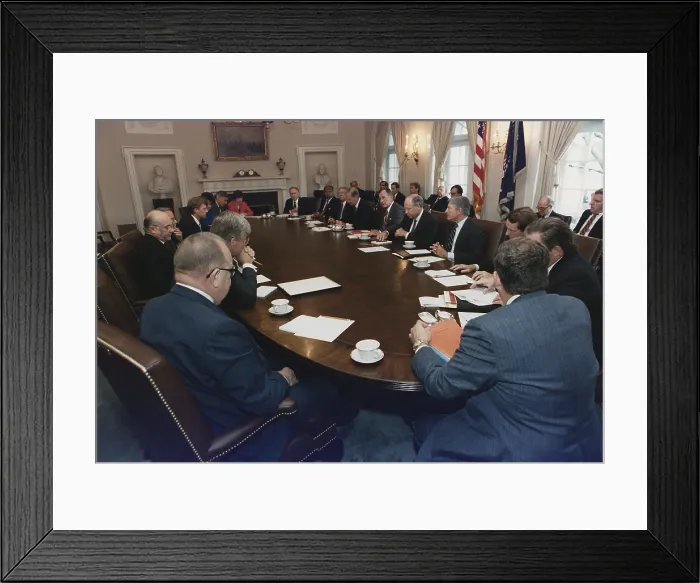 Framed Print : President George Bush conducts a full Cabinet Meeting in the White House Cabinet Room. 1989. Bush is seated between Sec. of State James Baker and Sec. of Defense Richard Cheney