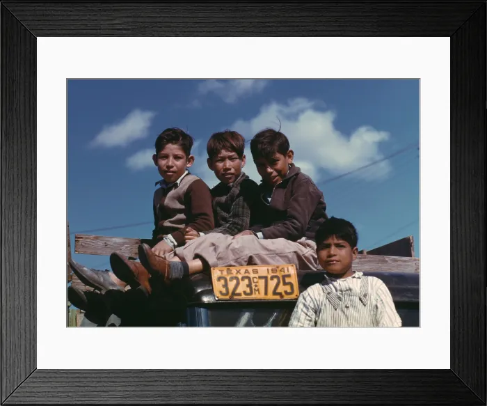 Framed Print : Boys sitting on truck parked at the FSA labor camp. Texas, Jan. 1942. Their families are residents at a U.S